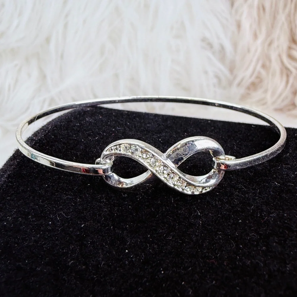 Silvertone bling accent Infinity Bracelet - Picture 6 of 11